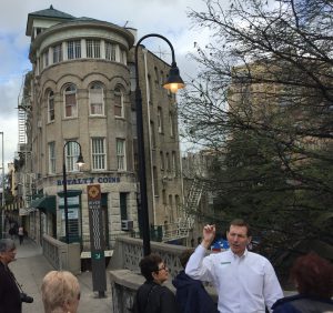 Picture of man talking about the architecture of a building Picture of man talking about the architecture of a building